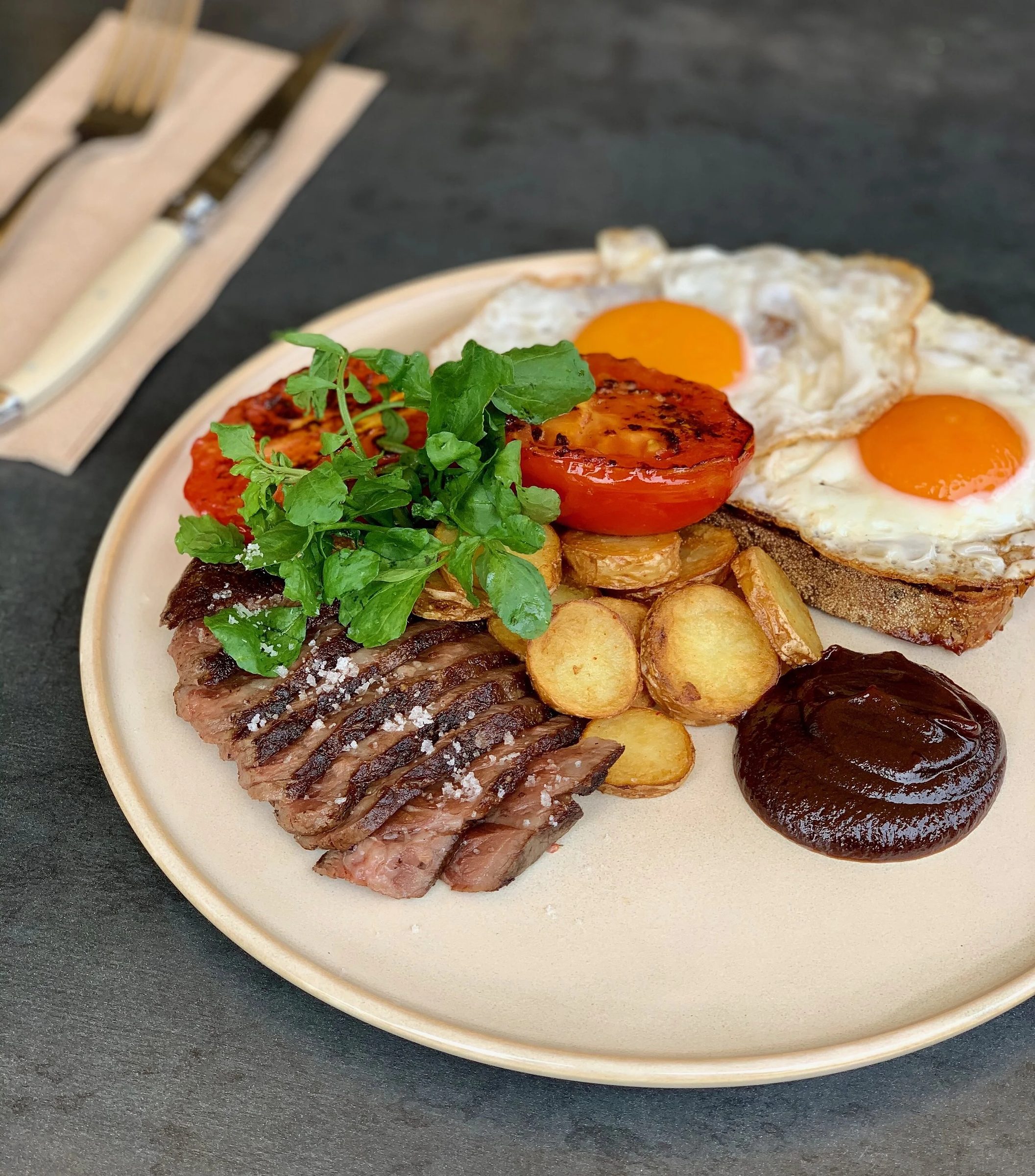 A big breakfast plate with fried eggs